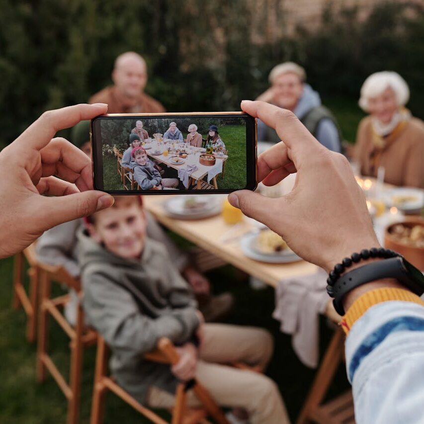 Taking a photo of family picnic