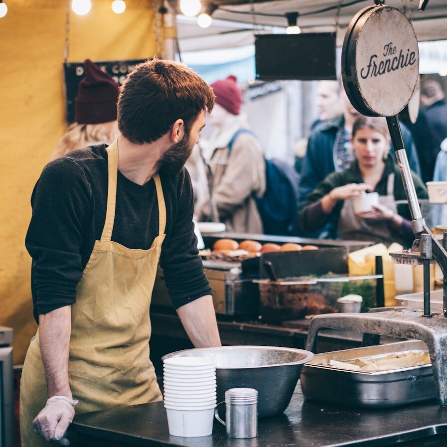 business owner working behind stand