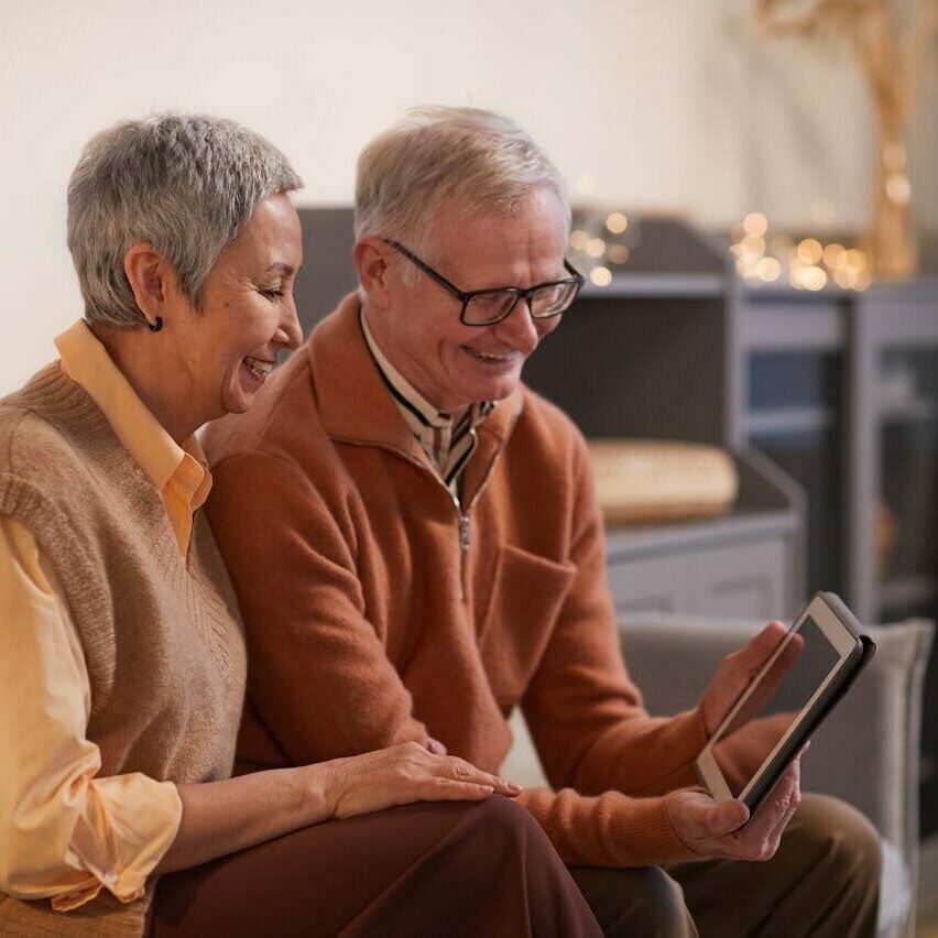 Two people looking at an ipad